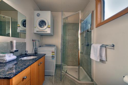 a bathroom with a shower and a sink at Freycinet Stone Studio 4 - Granite in Coles Bay