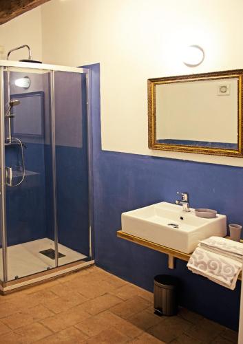 a bathroom with a sink and a shower at Corte La Volta in Piacenza