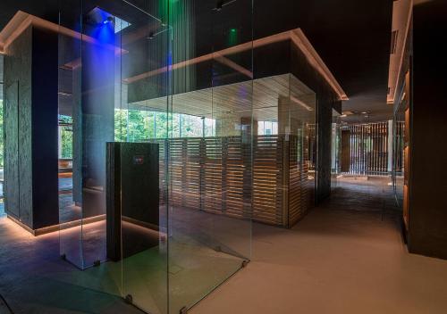 a glass exhibit in a building with a hallway at Terme Preistoriche Resort & Spa in Montegrotto Terme