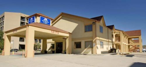 a building with a blue sign on top of it at Americas Best Value Inn and Suites Houston/Northwest Brookhollow in Houston