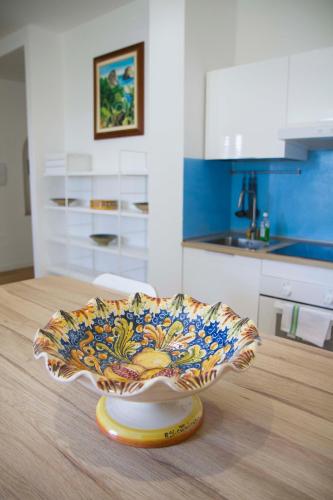 a bowl on top of a table in a kitchen at Villa Mallandrino in Mondello