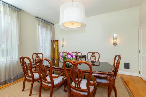 a dining room with a table and chairs at Fitzpatrick Manhattan in New York