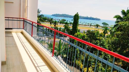 a balcony with a view of the ocean at Blue Bridge Homes in Port Blair