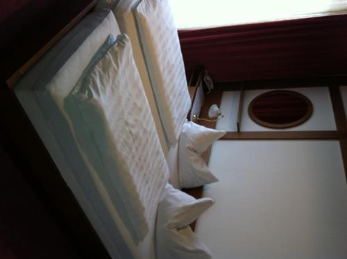 a couple of pillows are hanging on a wall at Maurer Gasthof-Vinothek in Gleisdorf