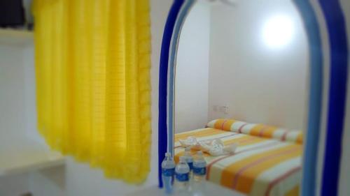 Postel nebo postele na pokoji v ubytování Hotel Olas Huatulco