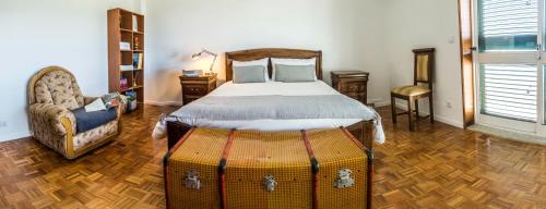 Un pat sau paturi într-o cameră la Casa do Luzio