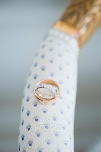 a wedding ring sitting on top of a tie at Mauritzbergs Slott & Golf in Mauritsberg