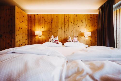 Postel nebo postele na pokoji v ubytování Gourmet - Boutique Hotel Tanzer