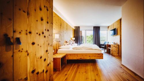 Postel nebo postele na pokoji v ubytování Gourmet - Boutique Hotel Tanzer