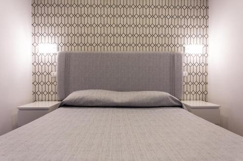 Una cama o camas en una habitación de B&B Maria Rosaria