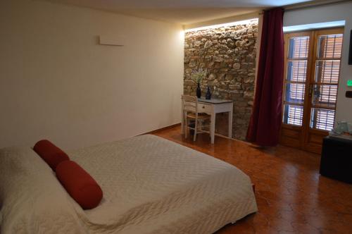 Postel nebo postele na pokoji v ubytování Casa Pulci