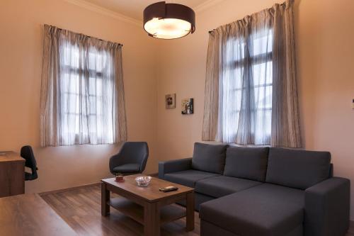 a living room with a couch and a table at MA-GIA in Pastida