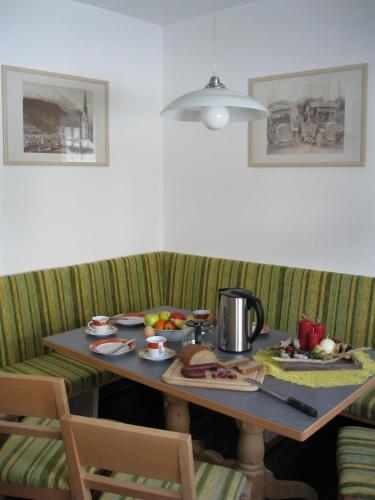 a table with food and a coffee pot on it at Ferienwohnung Abraham in Nauders