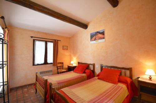 Ένα ή περισσότερα κρεβάτια σε δωμάτιο στο Chambre d'Hôtes Au Vieux Chêne