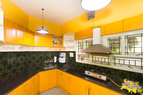 Kuchyň nebo kuchyňský kout v ubytování LikeMyHome Homestay Mysore