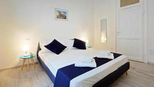 Ένα ή περισσότερα κρεβάτια σε δωμάτιο στο Pompeo Magno White Luxury Apartment
