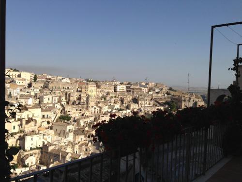 a group of white buildings on a hill at Riscatto 1514 in Matera