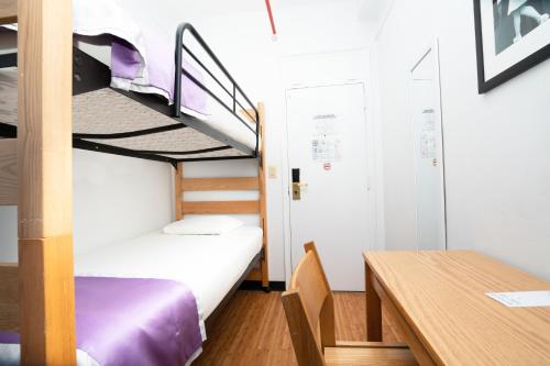 
A bunk bed or bunk beds in a room at Vanderbilt YMCA
