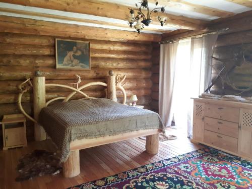 Ένα ή περισσότερα κρεβάτια σε δωμάτιο στο Котедж RIVER HILL