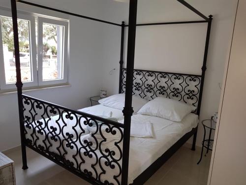 Un pat sau paturi într-o cameră la Villa Iva