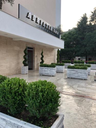 a building with bushes in front of a building at Adriatik Lux Apartments in Budva