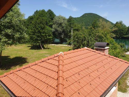 an orange tile roof on top of a house at Holiday Home Faruk in Račić