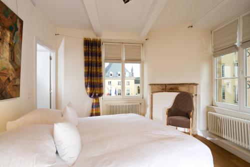 Cama ou camas em um quarto em Hotel Parc Beaux Arts