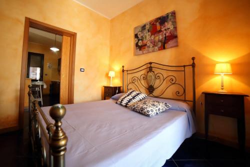 a bedroom with a bed with a pillow on it at Villetta mare Salento in Patù