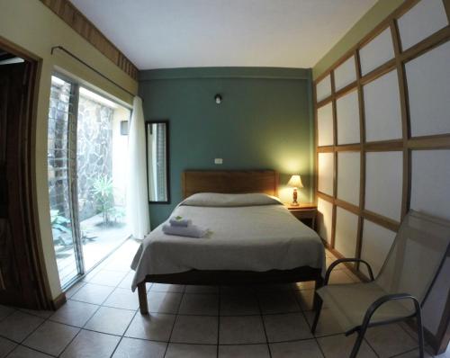 Postel nebo postele na pokoji v ubytování Hotel Guadalupe