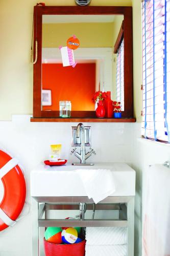 a bathroom with a sink and a mirror at Hotel Del Sol in San Francisco