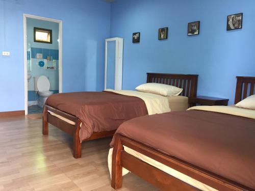 Llit o llits en una habitació de Baan Bussara