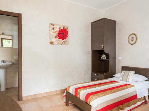 Postel nebo postele na pokoji v ubytování La casetta di richetto