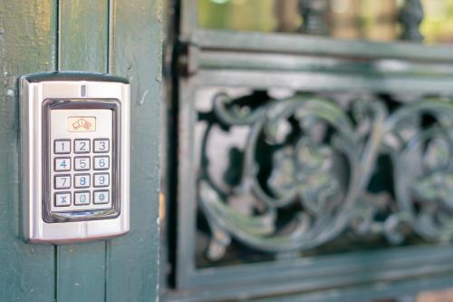 a close up of a cell phone on a door at Hostal Bocanegra in Granada