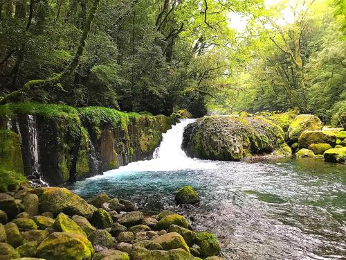 a waterfall in the middle of a river at Tubakiann in Kikuchi