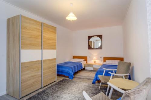 Posteľ alebo postele v izbe v ubytovaní Apartments Ivna