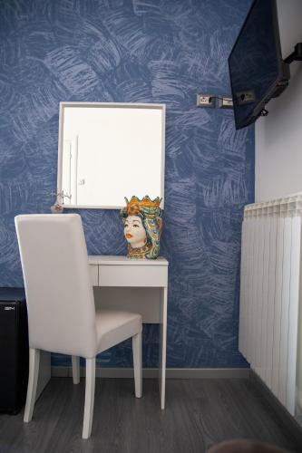 a white desk with a mirror and a chair at Casa del Marchese B&B in Riposto