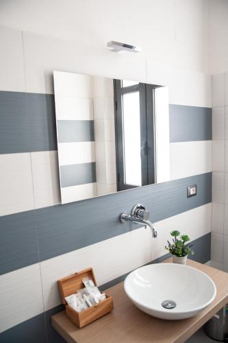 a bathroom with a sink and a mirror at Casa del Marchese B&B in Riposto