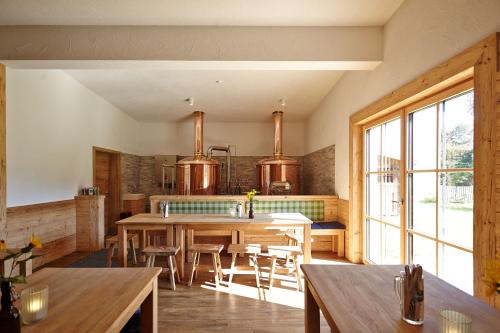 a kitchen with a table and chairs in a room at Hotel Gasthof Ochsen in Kißlegg