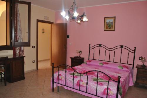 Ένα ή περισσότερα κρεβάτια σε δωμάτιο στο B&B Ippocampo