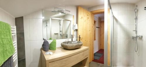 a bathroom with a sink and a mirror at Haus Felsneck in Sölden