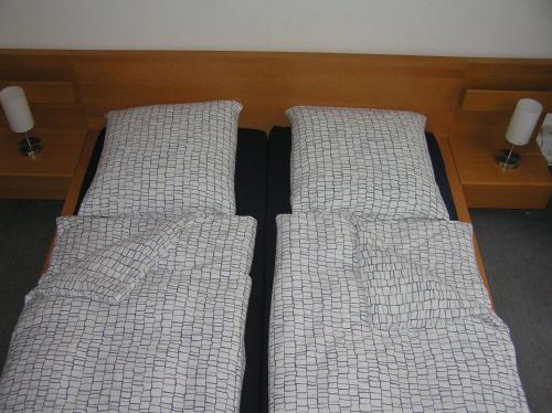 Cama o camas de una habitación en Gästezimmer Am Spielbergtor