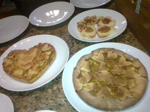 a table with plates of food with hearts on them at Country House Salomè in Musile di Piave