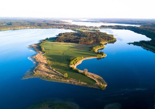 an island in the middle of a body of water at Camping Swory in Swornegacie 