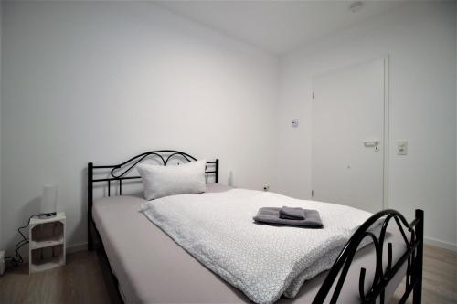 Ένα ή περισσότερα κρεβάτια σε δωμάτιο στο High-quality apartments near Residence - parking space