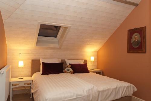 Säng eller sängar i ett rum på oyenkerke-loft