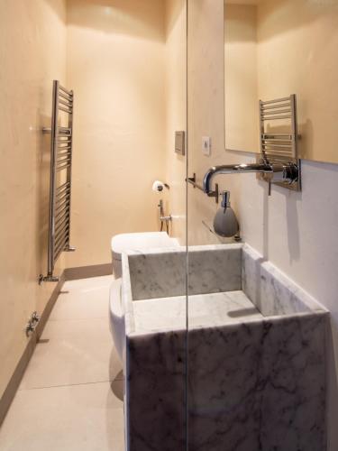 a bathroom with a marble sink and a shower at Il Sognaposto in Arezzo