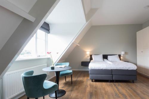 Un pat sau paturi într-o cameră la B&B de Lijsterhof