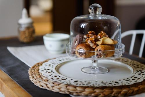 a bowl of food in a glass dish on a table at Sacratum B&B Suite Spa in Mesagne