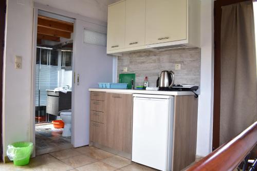 a kitchen with a sink and a counter top at Marinakis Sea View Studios in Sougia
