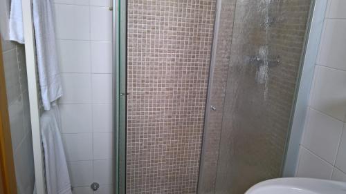 a shower with a glass door in a bathroom at Hotel Ristorante alla Campagna in San Giovanni Lupatoto